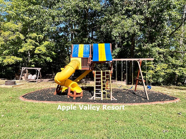 view of jungle gym featuring a lawn