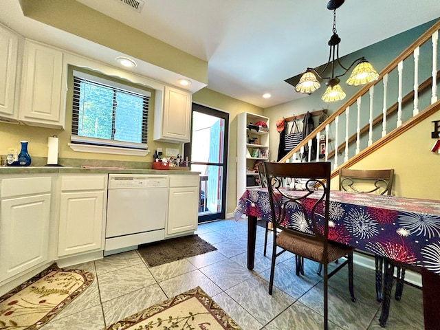 kitchen with white cabinets, dishwasher, decorative light fixtures, and a chandelier