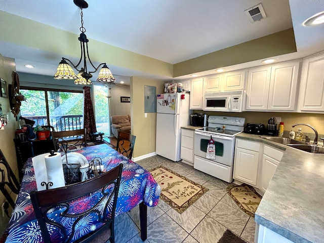 kitchen featuring pendant lighting, light tile patterned floors, sink, white appliances, and white cabinetry