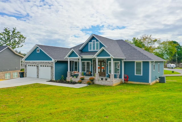 craftsman house featuring covered porch, a front lawn, a garage, and cooling unit