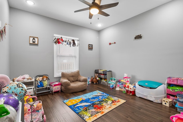 playroom featuring ceiling fan and dark wood-type flooring