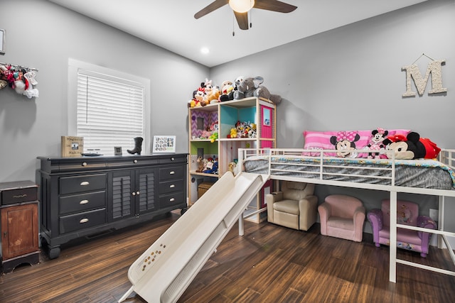 bedroom featuring ceiling fan and dark hardwood / wood-style floors