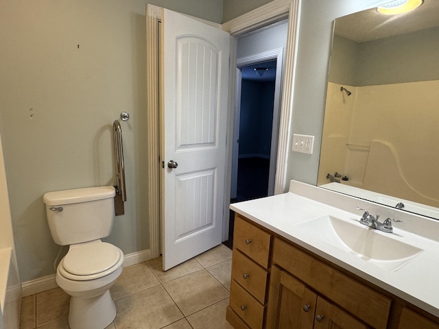 full bathroom with tile patterned floors, vanity, tub / shower combination, and toilet