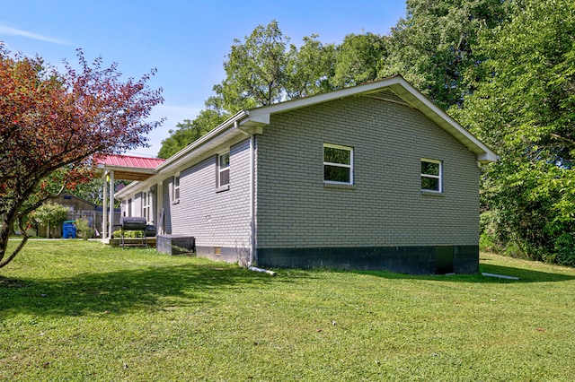 view of home's exterior featuring a yard