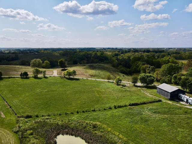 birds eye view of property with a rural view