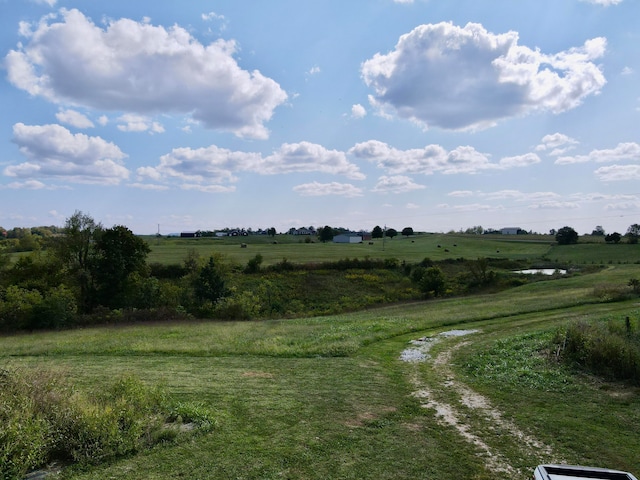 exterior space with a water view and a rural view