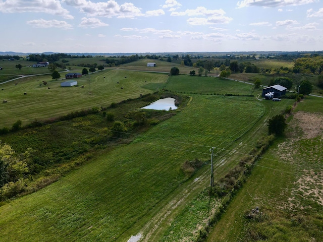 aerial view featuring a rural view and a water view