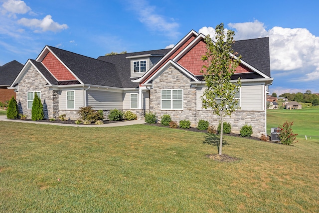 craftsman house featuring a front yard