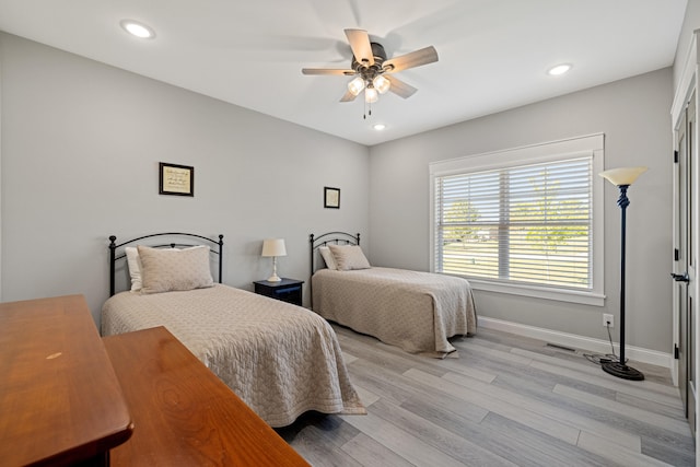 bedroom featuring ceiling fan and light wood-type flooring