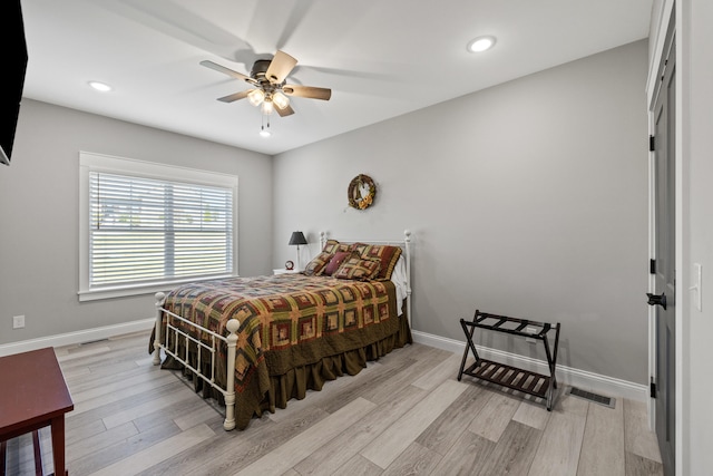 bedroom featuring ceiling fan and light hardwood / wood-style flooring