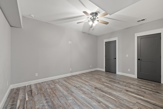 unfurnished bedroom with ceiling fan and light hardwood / wood-style floors