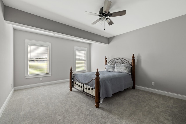 bedroom with ceiling fan and carpet