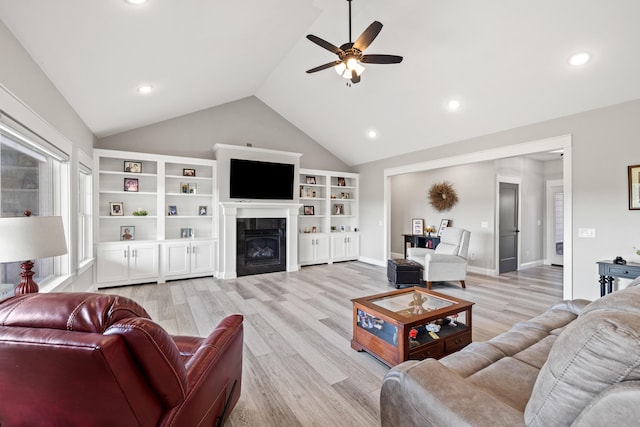 living room featuring light wood-type flooring, lofted ceiling, and ceiling fan