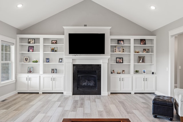 living room with lofted ceiling and light hardwood / wood-style floors