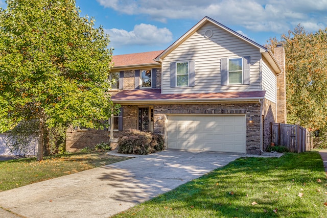 view of front property with a front yard and a garage