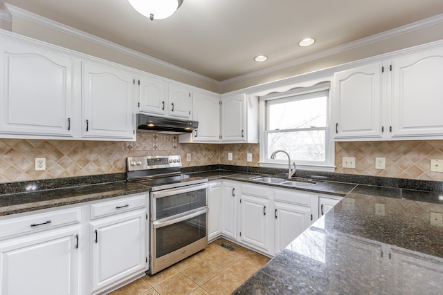 kitchen featuring double oven range, sink, white cabinets, and light tile patterned flooring