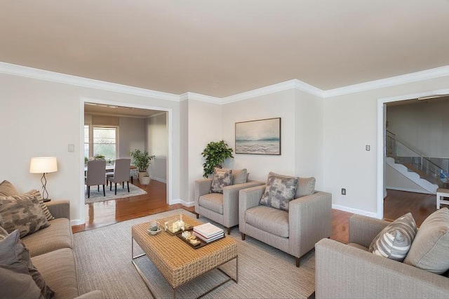 living room with light hardwood / wood-style flooring and ornamental molding