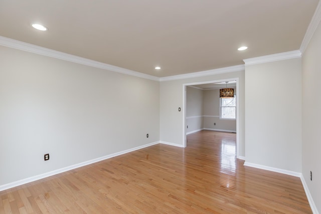 unfurnished room with ornamental molding and light hardwood / wood-style floors