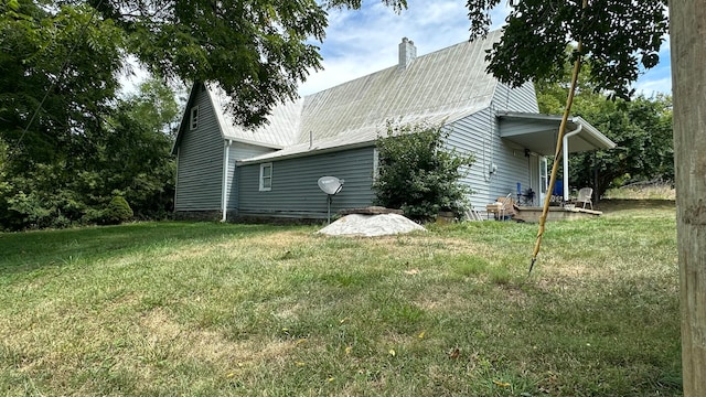 view of home's exterior with a yard