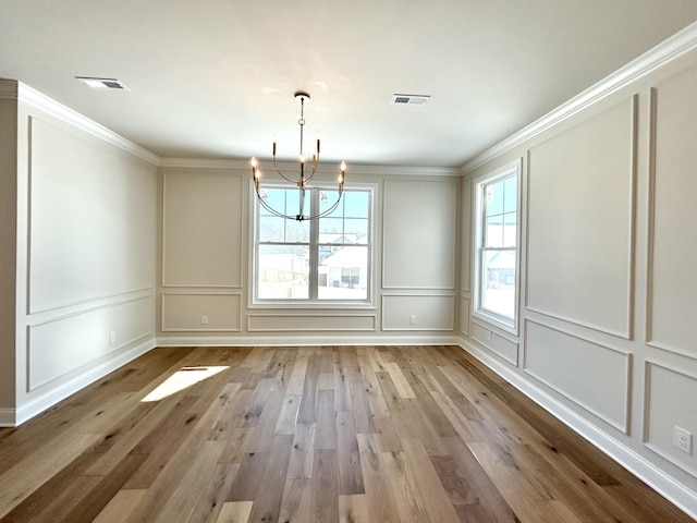 unfurnished dining area with a healthy amount of sunlight, visible vents, and a decorative wall