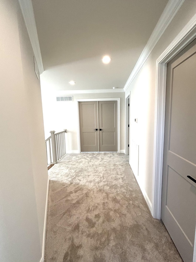 corridor with recessed lighting, visible vents, ornamental molding, carpet flooring, and baseboards