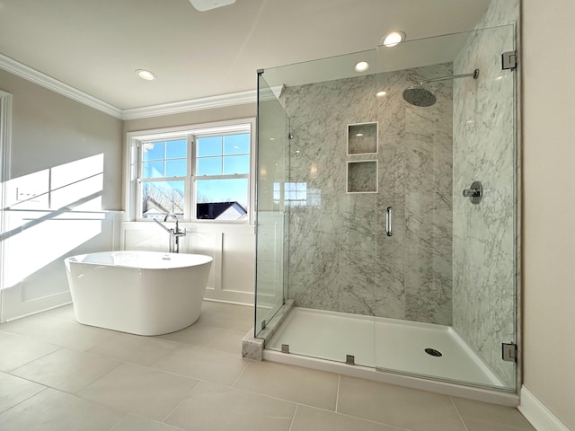 full bathroom featuring a soaking tub, a shower stall, ornamental molding, and tile patterned flooring