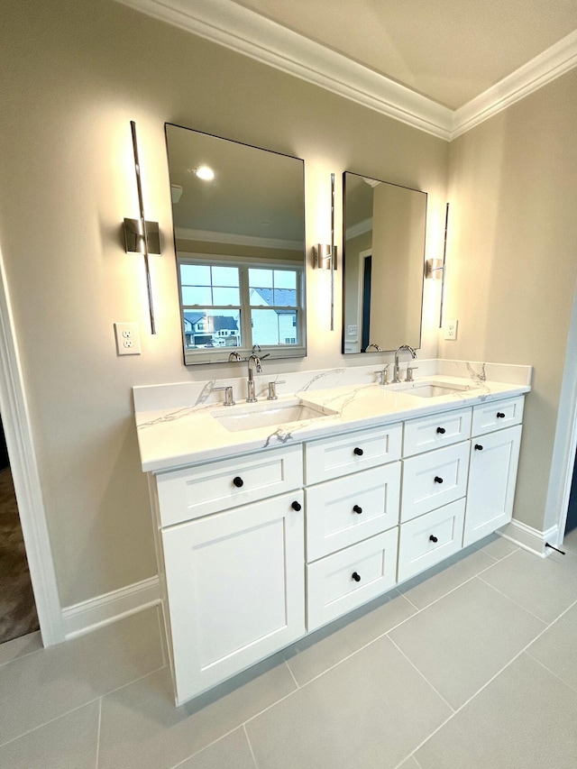 bathroom with tile patterned flooring, a sink, and crown molding