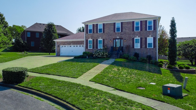 colonial-style house with a garage and a front lawn