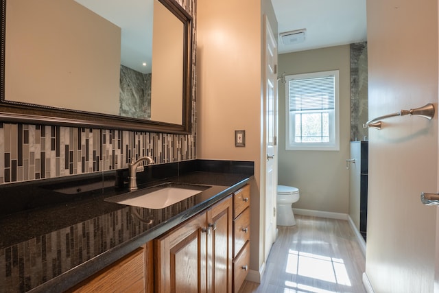 bathroom with tile patterned floors, vanity, and toilet