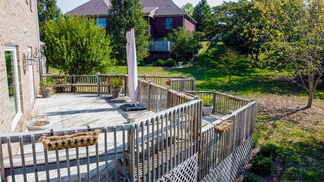 wooden deck with a yard