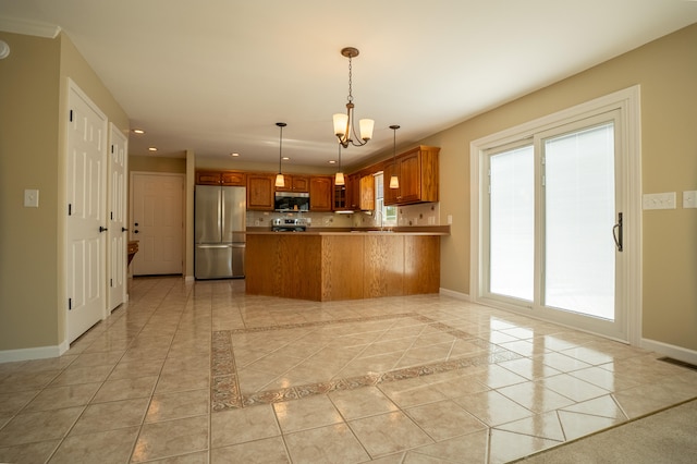 kitchen featuring pendant lighting, light tile patterned flooring, a notable chandelier, kitchen peninsula, and appliances with stainless steel finishes