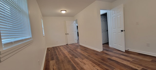 entryway with dark hardwood / wood-style floors