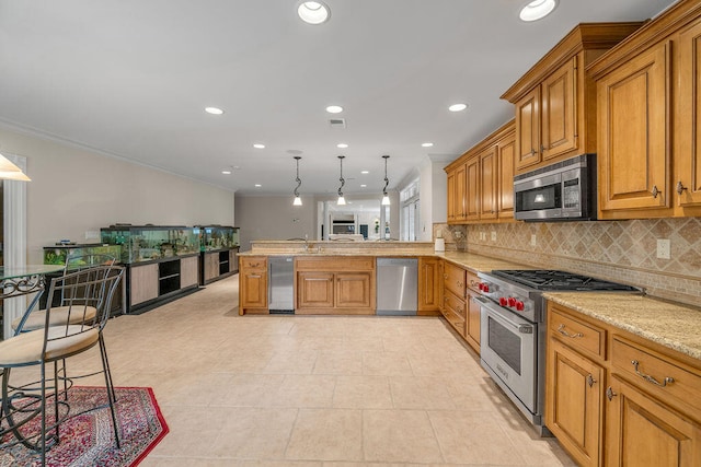 kitchen featuring appliances with stainless steel finishes, light tile patterned floors, kitchen peninsula, and pendant lighting