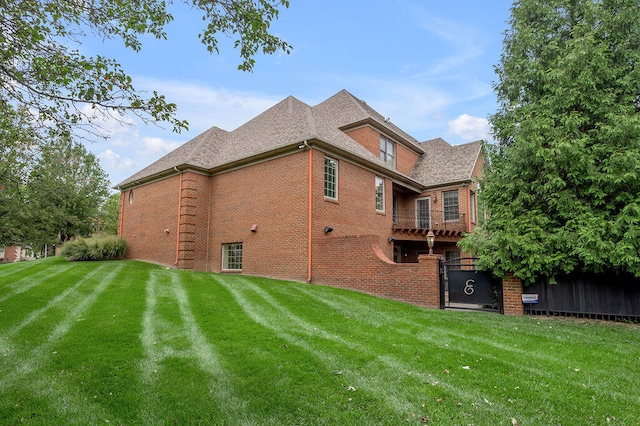 view of home's exterior with a yard