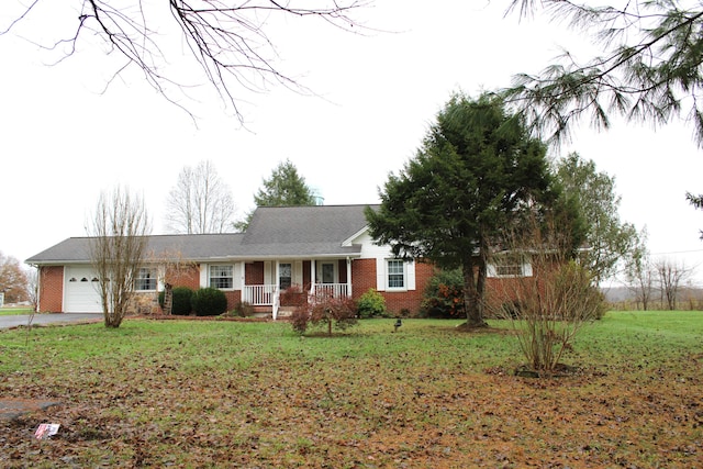 ranch-style house with a front lawn, covered porch, and a garage