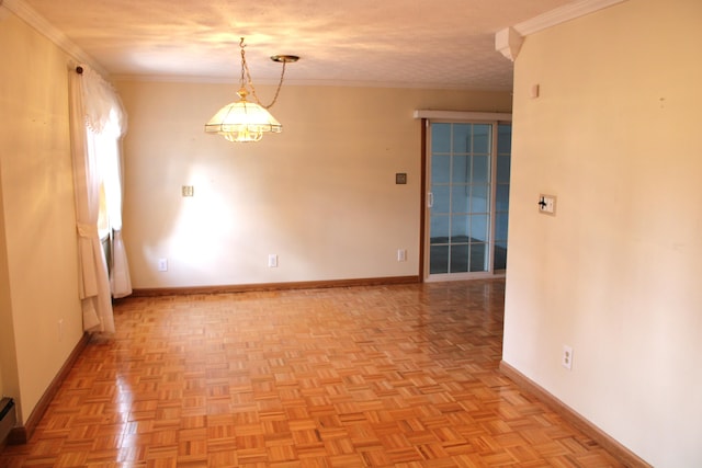 spare room featuring a textured ceiling, ornamental molding, baseboard heating, and light parquet flooring