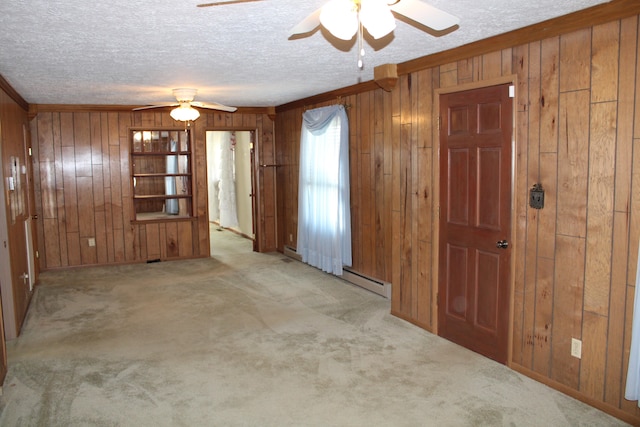 spare room with light colored carpet and ceiling fan