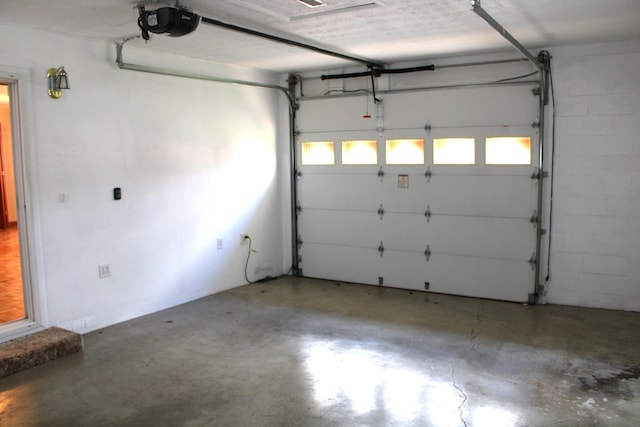 garage featuring a garage door opener