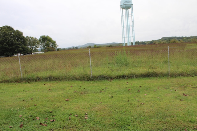 view of yard with a rural view