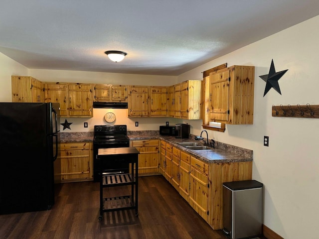 kitchen with a textured ceiling, sink, dark hardwood / wood-style flooring, and black appliances