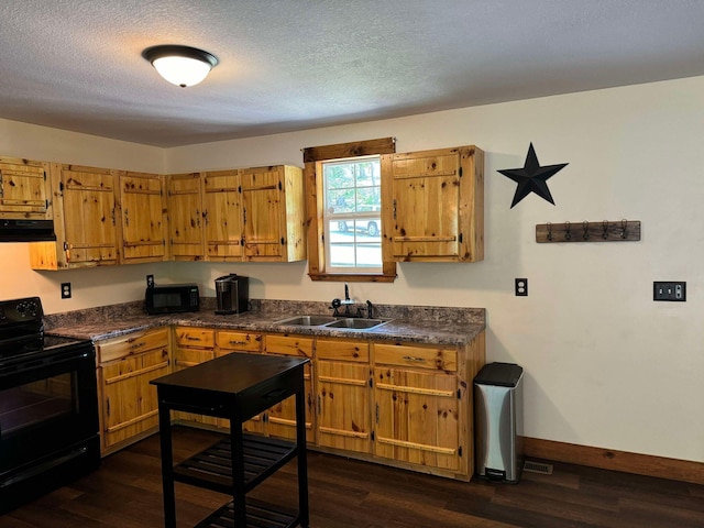 kitchen featuring sink, dark hardwood / wood-style flooring, a textured ceiling, and black appliances