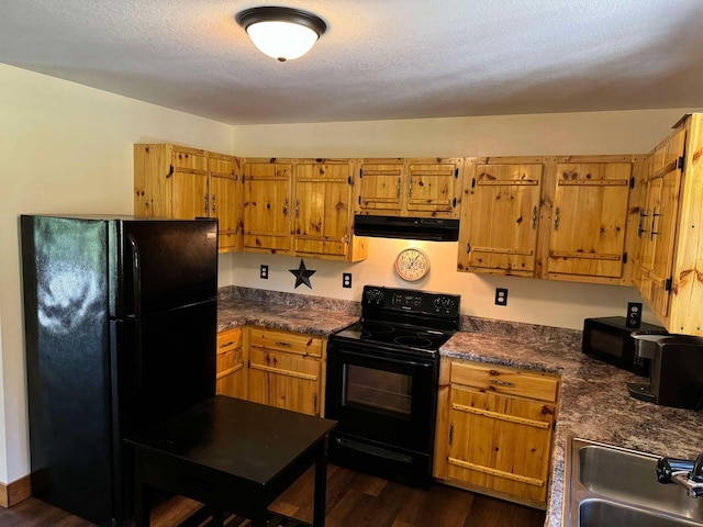 kitchen with black appliances, a textured ceiling, dark hardwood / wood-style floors, and sink