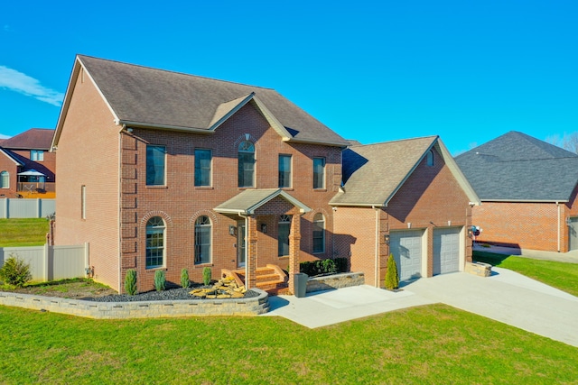 view of front of property featuring a garage and a front lawn