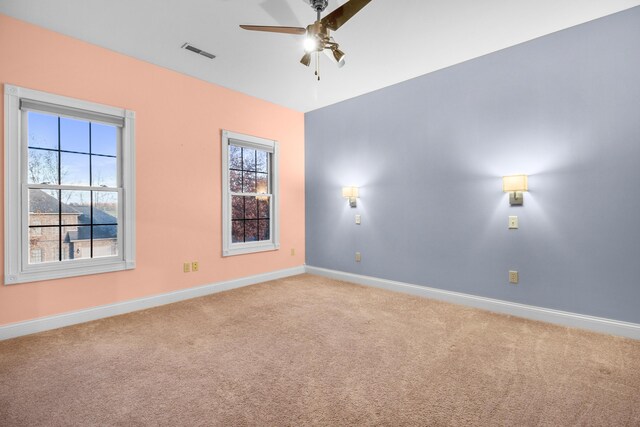 carpeted empty room with ceiling fan