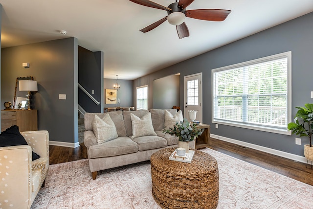 living room featuring ceiling fan, hardwood / wood-style floors, and a healthy amount of sunlight