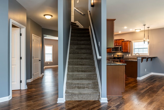 staircase featuring hardwood / wood-style floors