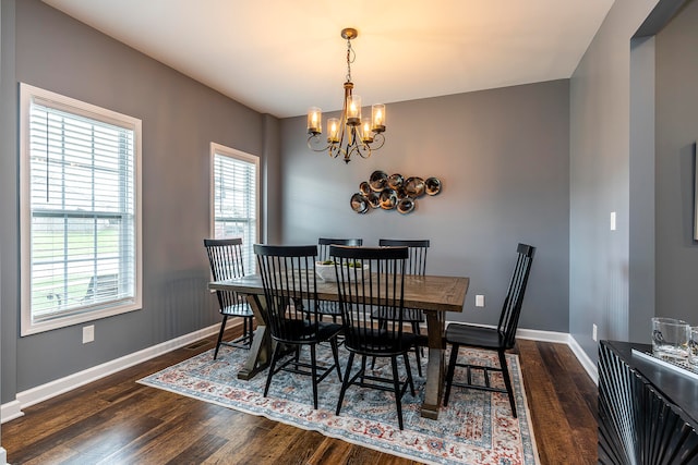 dining space featuring a chandelier and dark hardwood / wood-style flooring