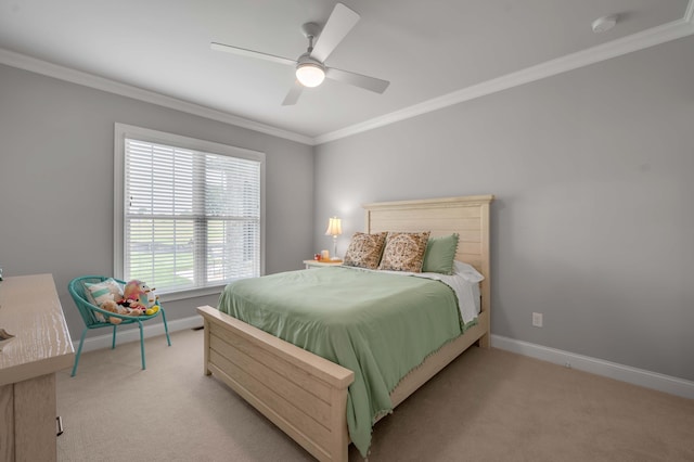 bedroom with baseboards, carpet, ceiling fan, and crown molding