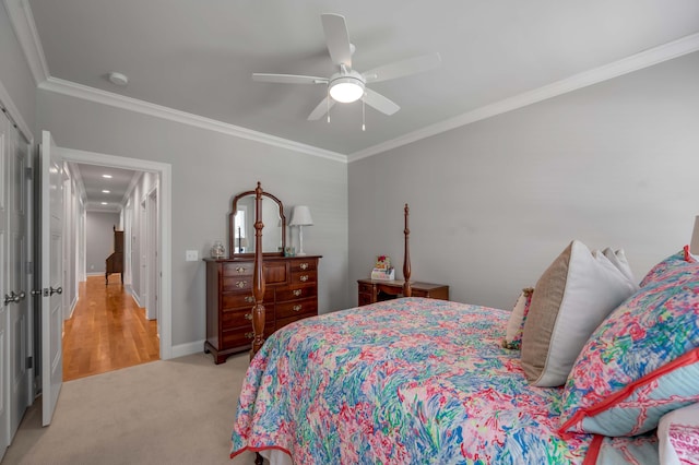 bedroom featuring baseboards, light colored carpet, ceiling fan, and crown molding