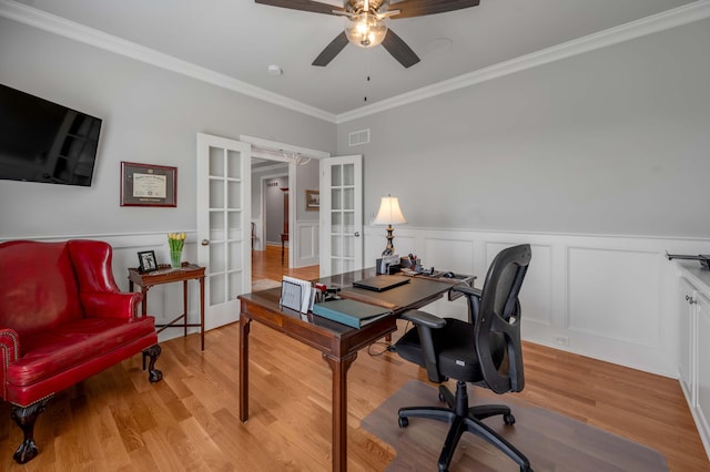 home office with light wood-style flooring, french doors, crown molding, and ceiling fan